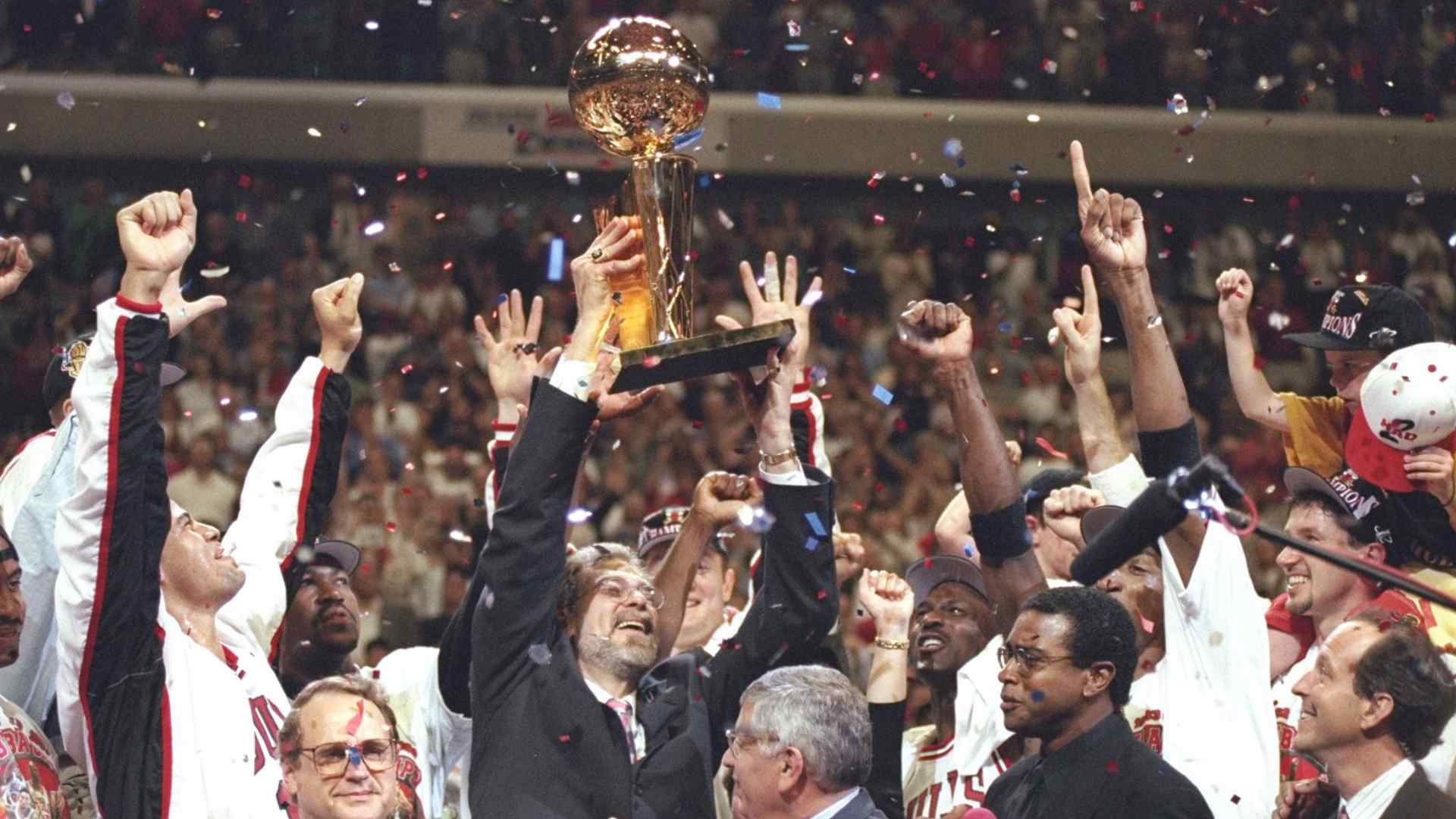 The Chicago Bulls lifting the NBA trophy. (Image credit: facecbook/NBA)